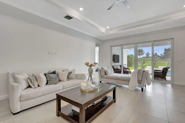 a large kitchen with kitchen island a sink a center island a stove a dining table and chairs