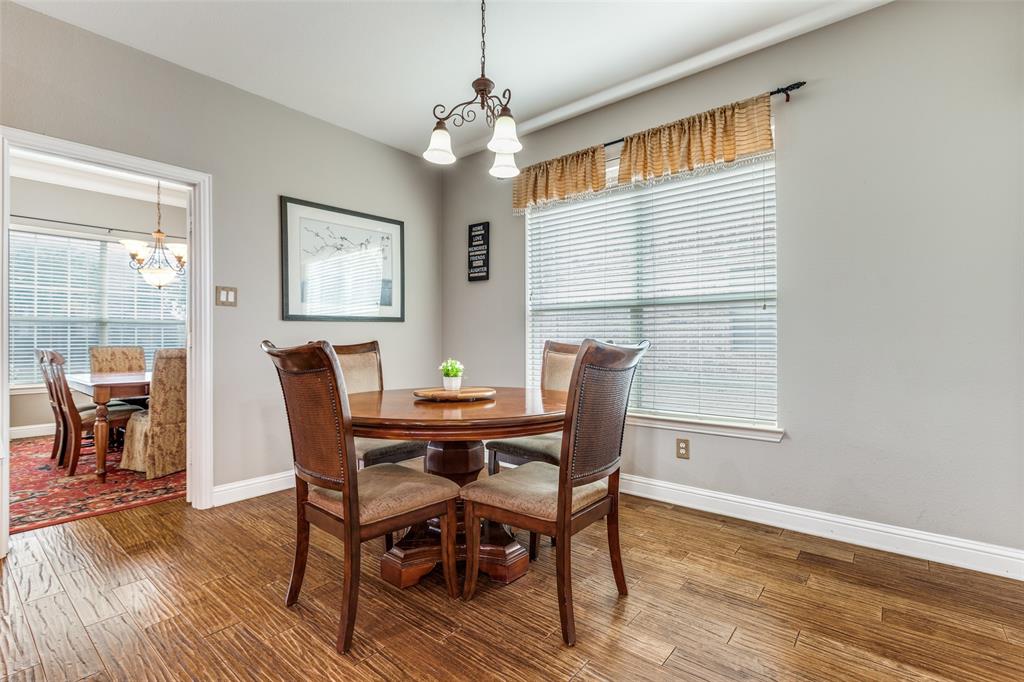 14886 Daneway Drive Frisco, TX 75035 - Photo 12 of 30 a view of a dining room with furniture window and wooden floor