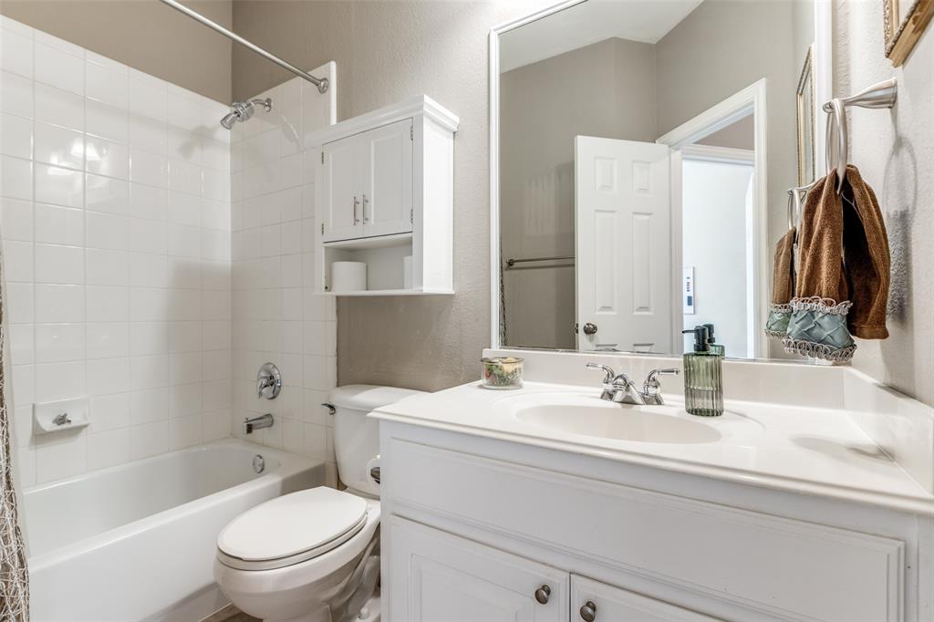 14886 Daneway Drive Frisco, TX 75035 - Photo 16 of 30 a bathroom with a sink toilet tub and shower