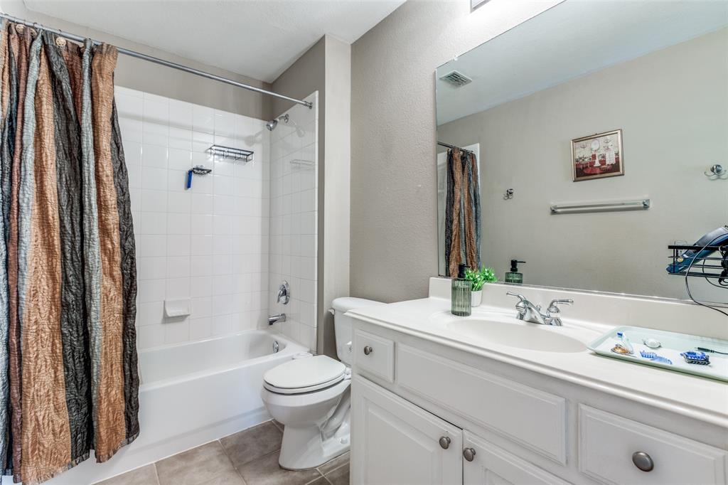 14886 Daneway Drive Frisco, TX 75035 - Photo 20 of 30 a bathroom with a sink a toilet and shower