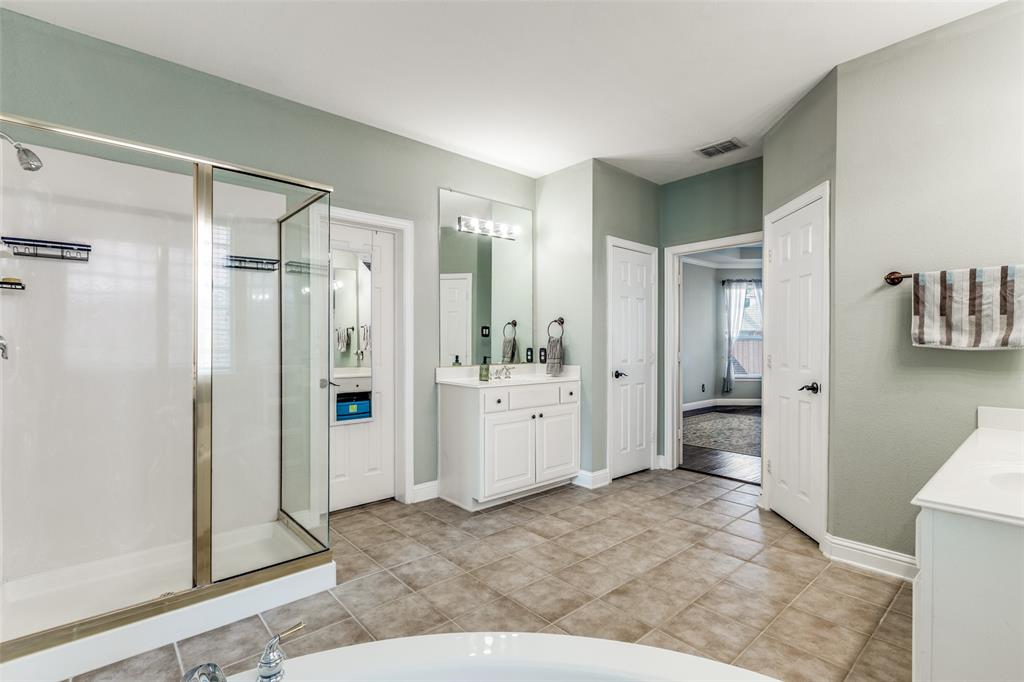 14886 Daneway Drive Frisco, TX 75035 - Photo 23 of 30 a bathroom with a sink a toilet and shower