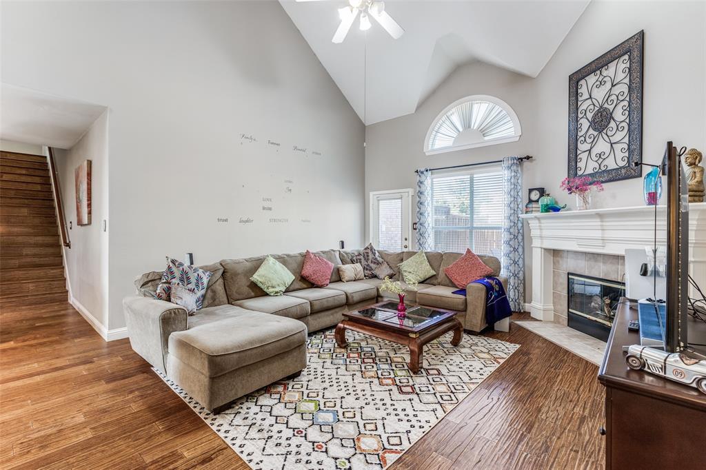 14886 Daneway Drive Frisco, TX 75035 - Photo 6 of 30 a living room with furniture and a fireplace
