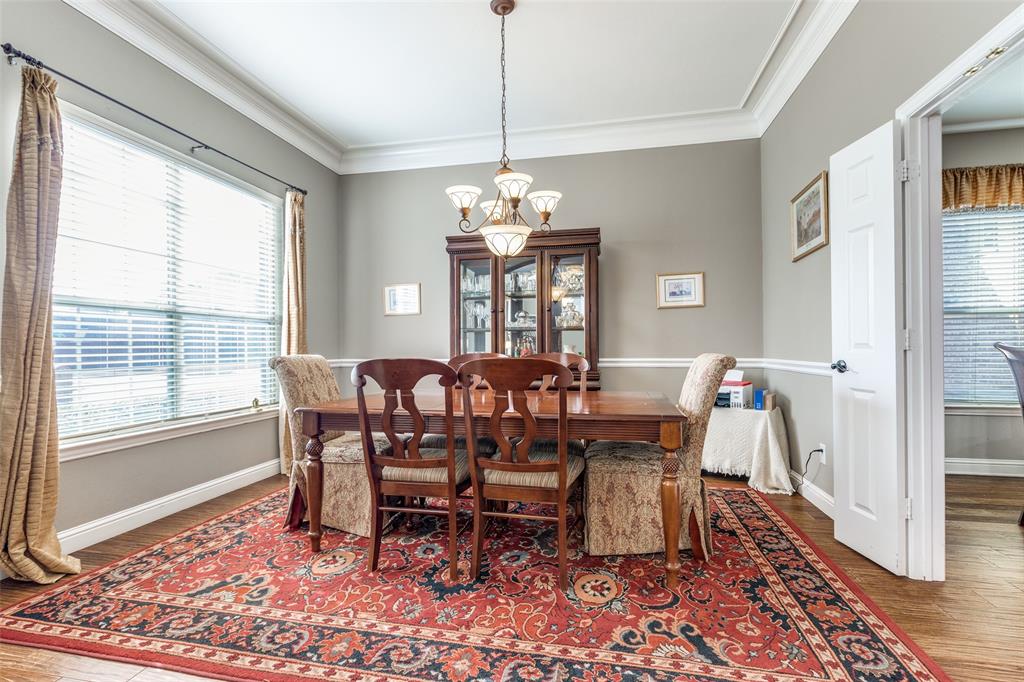 14886 Daneway Drive Frisco, TX 75035 - Photo 8 of 30 a view of a dining room with furniture window and wooden floor