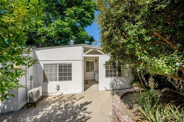 a house with trees in front of it