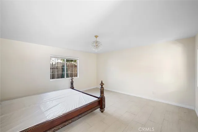 a bed room with a bed and a window