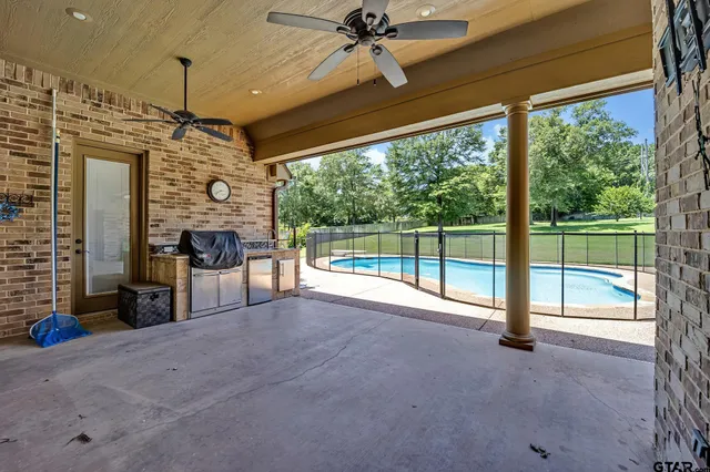 a view of a livingroom with furniture and floor to ceiling window
