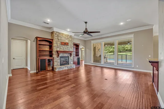 a view of a livingroom with furniture wooden floor and window