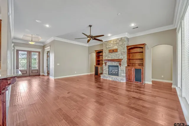 a view of a livingroom with a furniture wooden floor and window