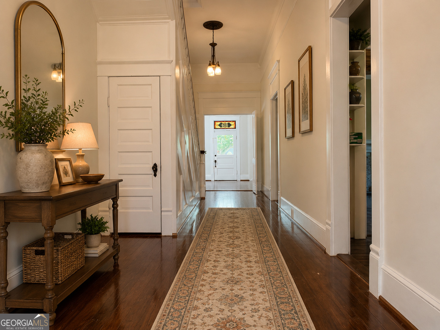 316 West Church Street Fort Valley, GA 31030 - Photo 15 of 28 a view of a hallway with wooden floor and a potted plant