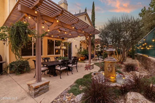 a patio with table and chairs