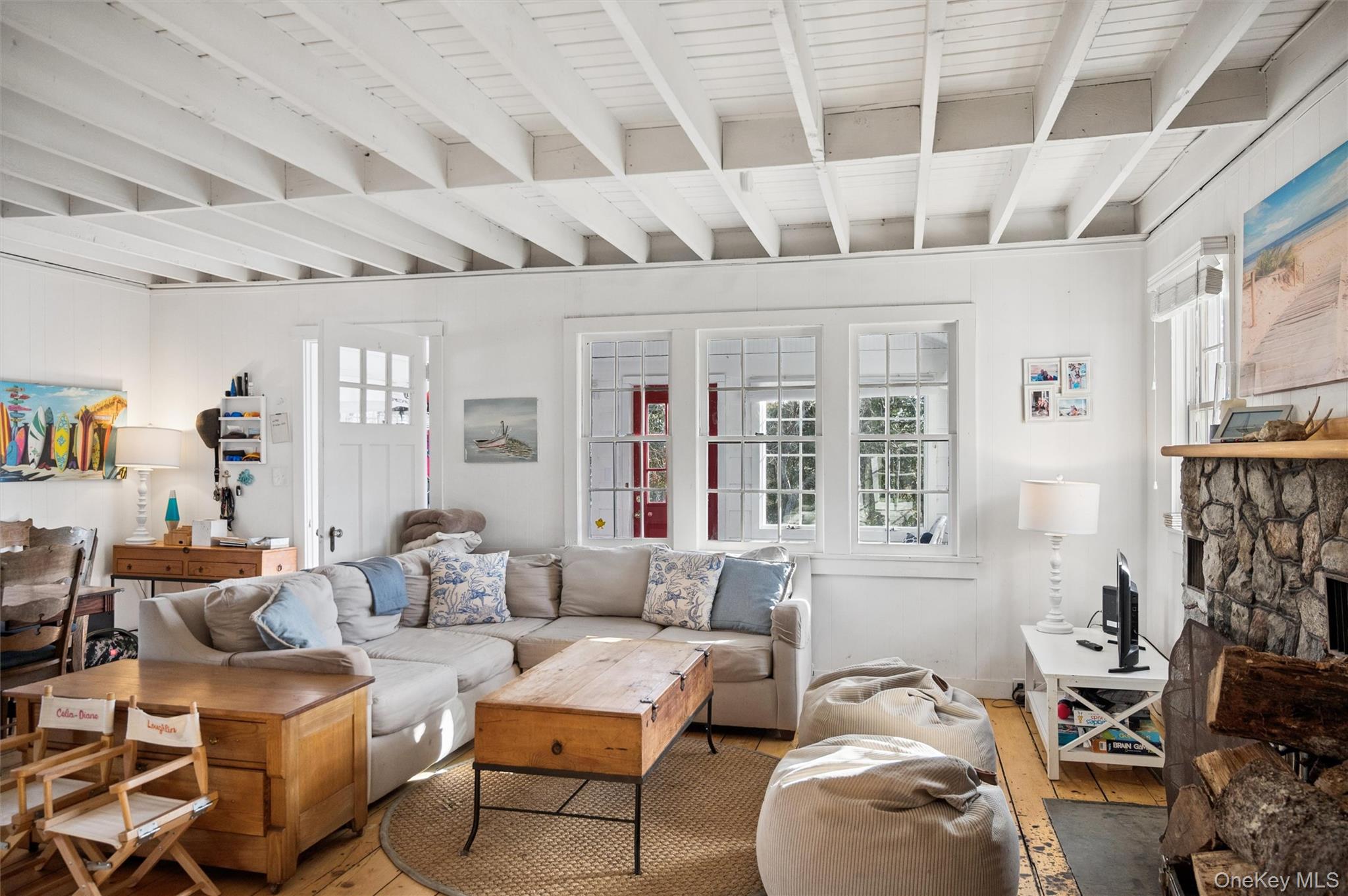 6 Private Row Hampton Bays, NY 11946 - Photo 3 of 14 a living room with furniture and a large window