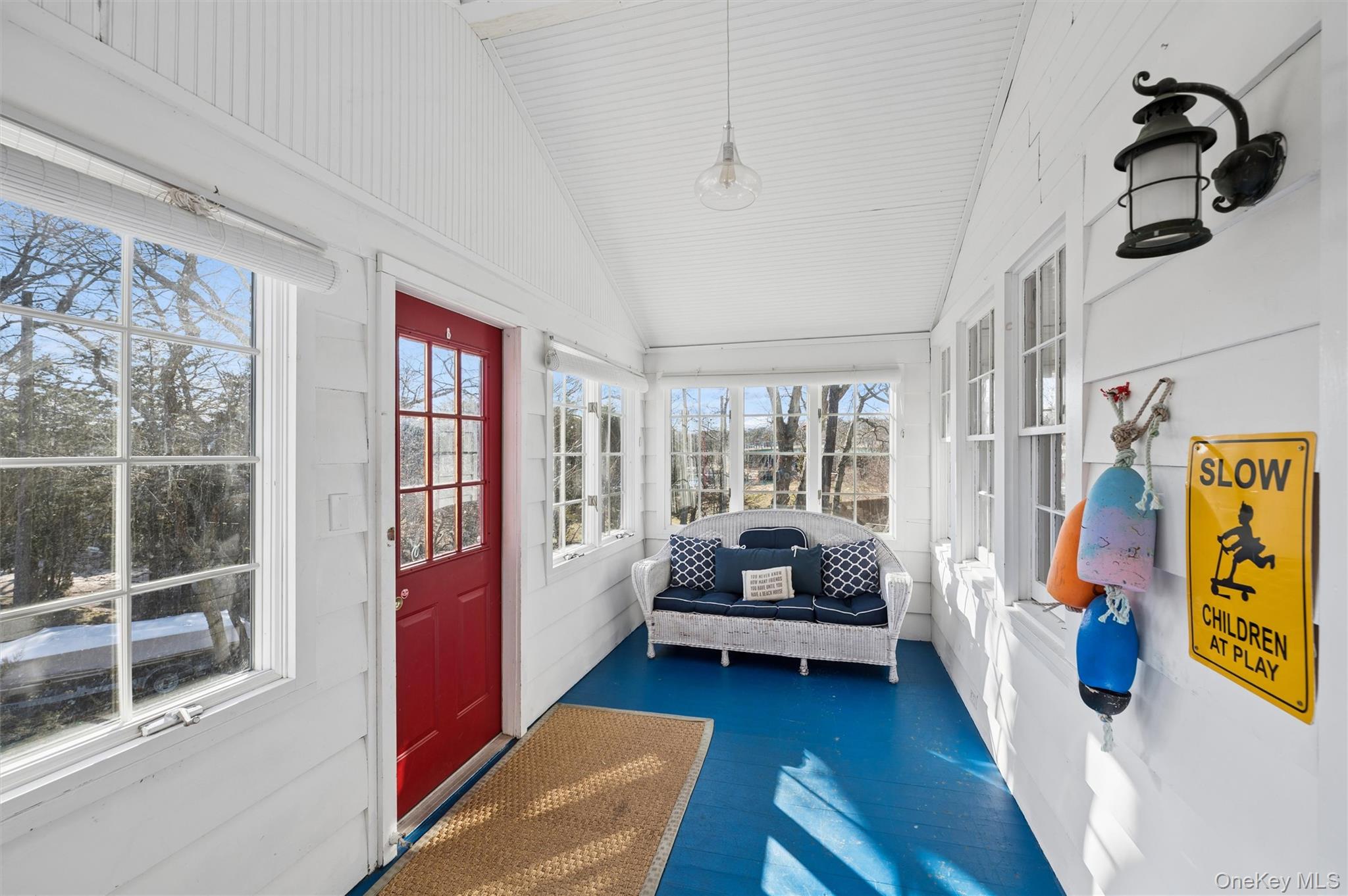 6 Private Row Hampton Bays, NY 11946 - Photo 6 of 14 a bedroom with furniture and a large window