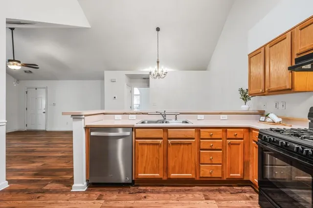 a kitchen with a stove and a sink