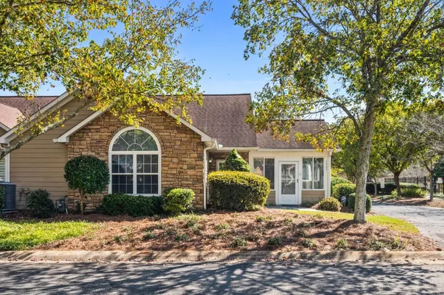 a view of a house with a yard