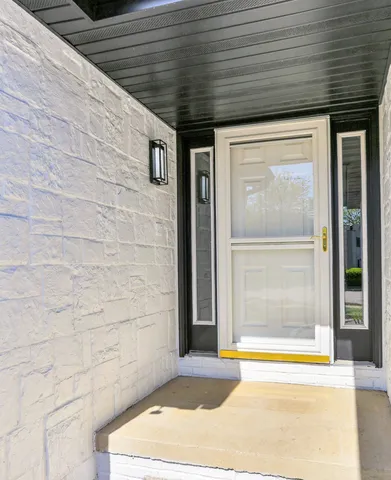 a view of a kitchen with a sink and a fireplace