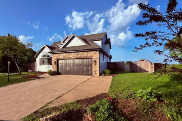 a kitchen with a sink a counter and cabinets