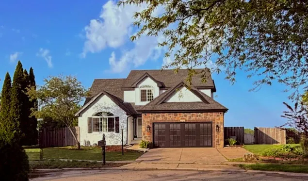 a kitchen with a refrigerator and a sink