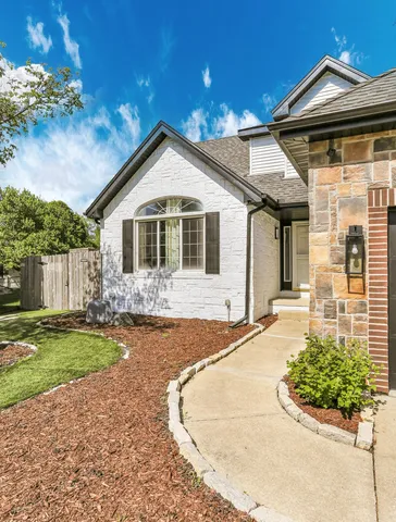 a view of a living room and chandelier