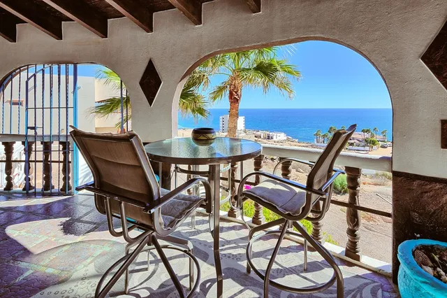 a view of a chairs and tables in patio