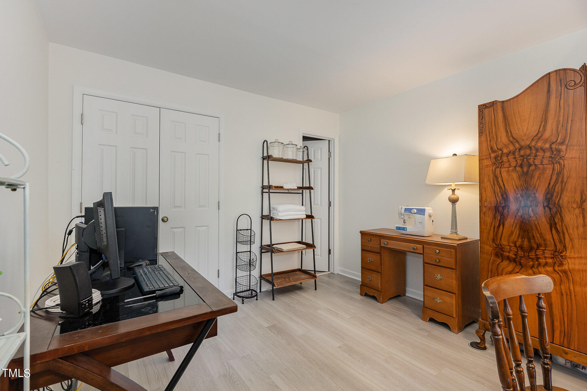 3639 Mill Run, Unit 12 Raleigh, NC 27612 - Photo 12 of 16 a view of a workspace with furniture and a window