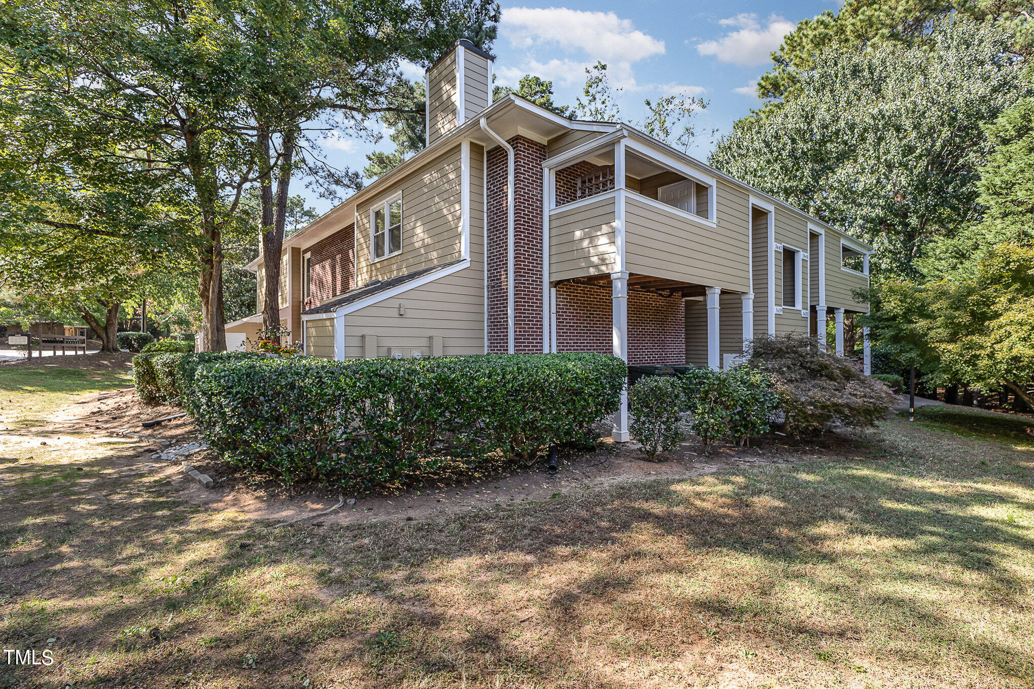 3639 Mill Run, Unit 12 Raleigh, NC 27612 - Photo 16 of 16 a front view of a house with a yard