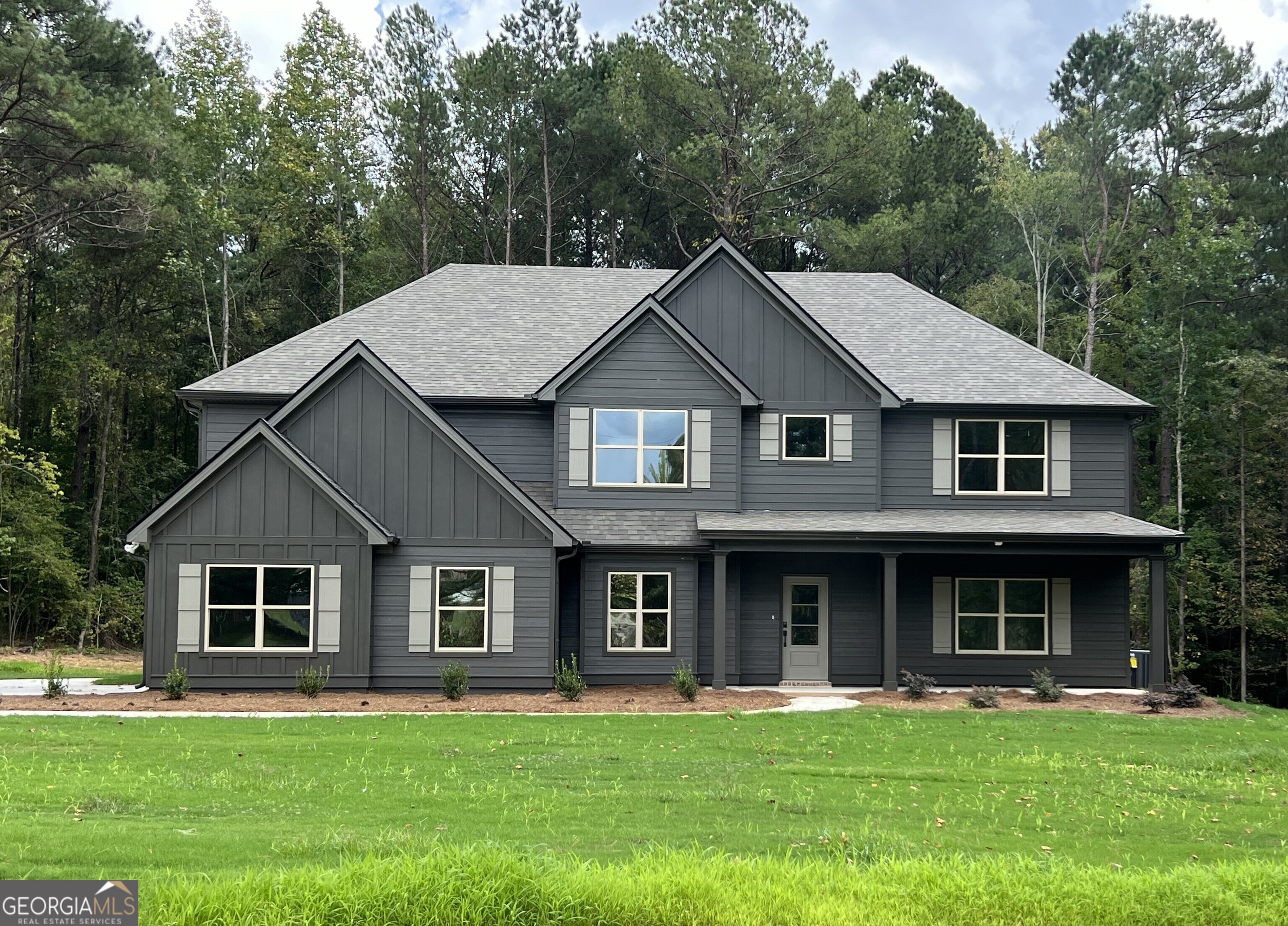 306 County Line Church Road Griffin, GA 30223 - Photo 1 of 1 a front view of a house with a garden
