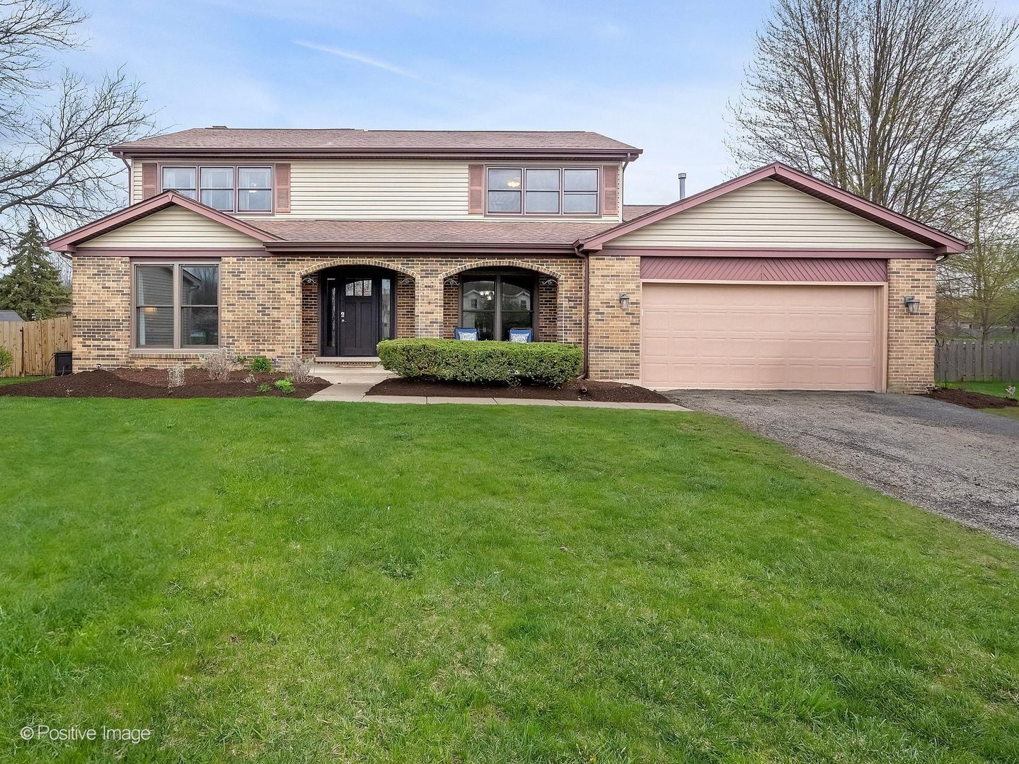 612 Stuart Drive Carol Stream, IL 60188 - Photo 1 of 29 a front view of a house with a garden and yard
