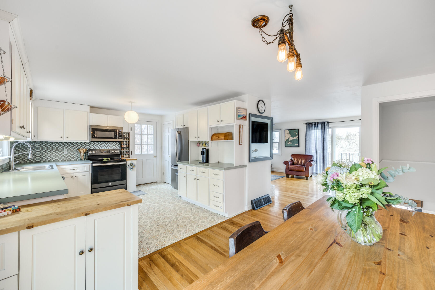 25 Cranberry Road Eastham, MA 02642 - Photo 45 of 45 a kitchen with a refrigerator a stove and a sink