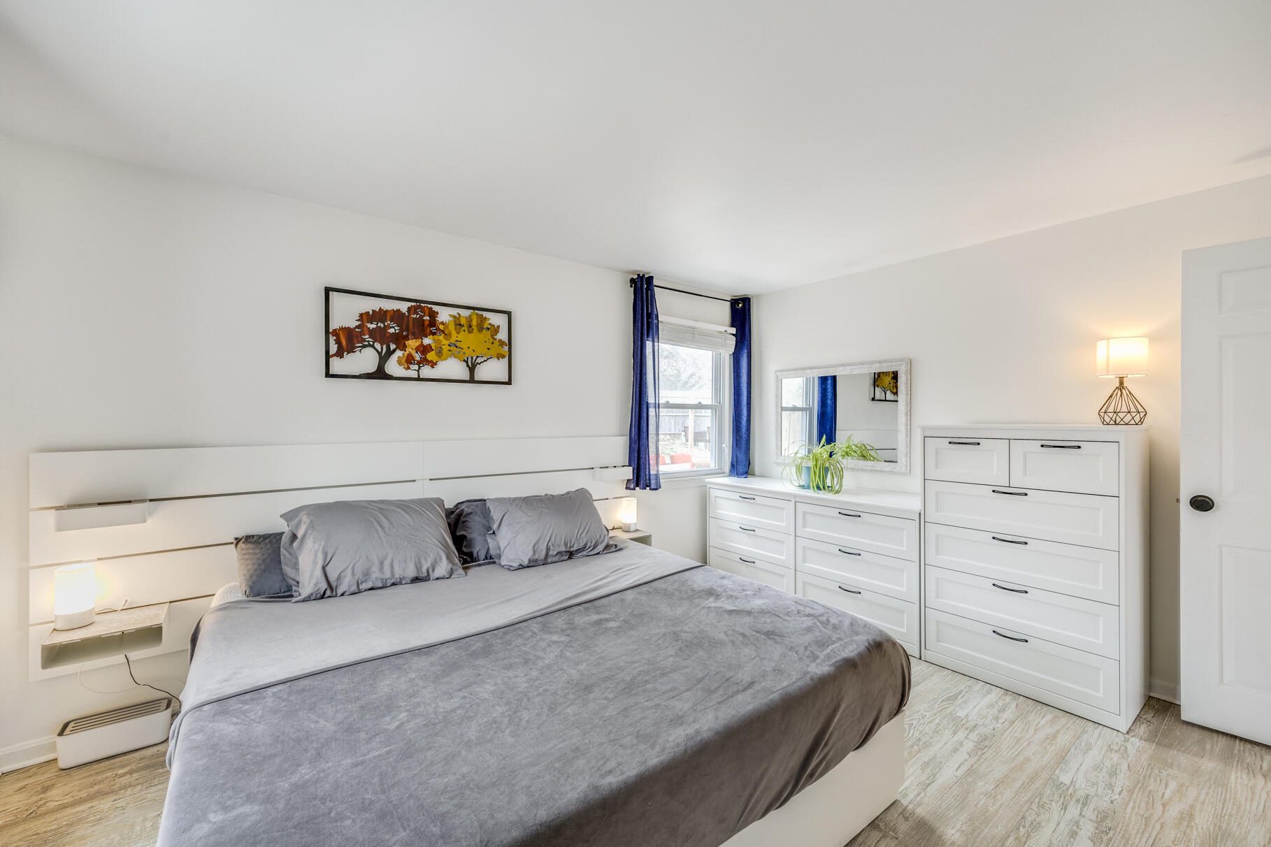 25 Cranberry Road Eastham, MA 02642 - Photo 20 of 45 a bedroom with a bed and painting on the wall