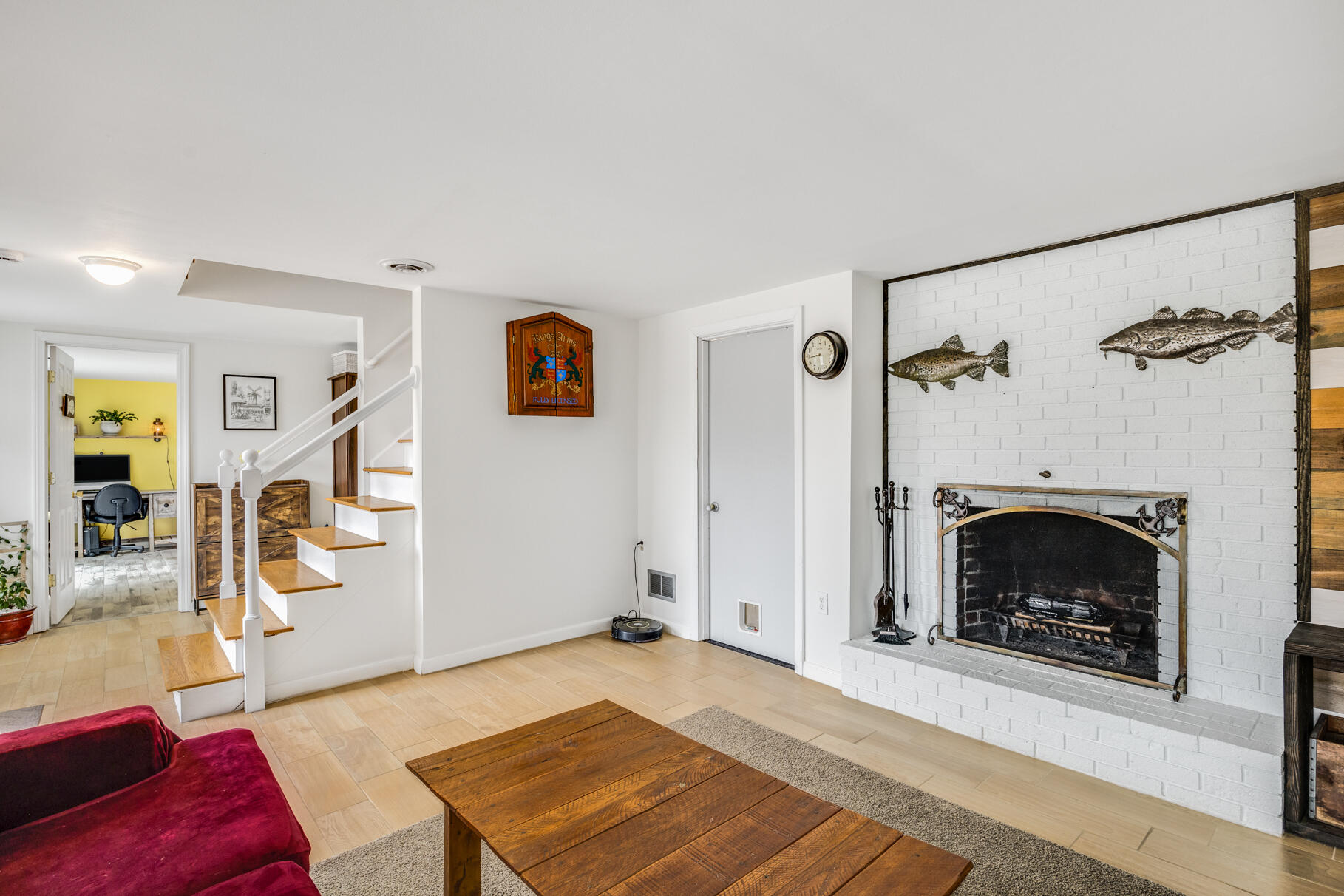 25 Cranberry Road Eastham, MA 02642 - Photo 27 of 45 a living room with furniture and a fireplace