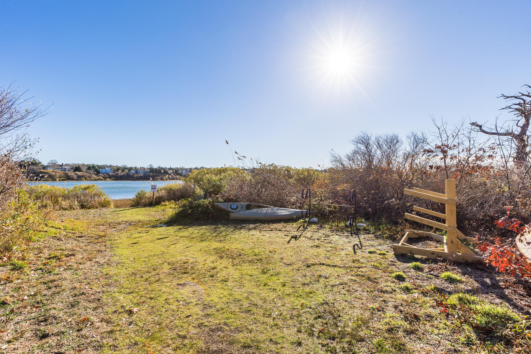25 Cranberry Road Eastham, MA 02642 - Photo 3 of 45 a view of a lake with a building in the background