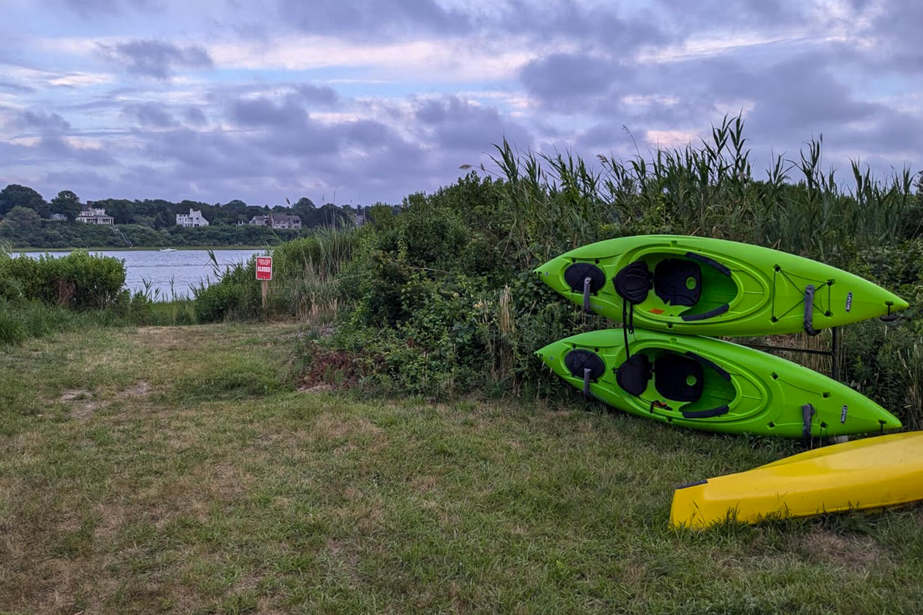 25 Cranberry Road Eastham, MA 02642 - Photo 4 of 45 a view of a garden with a slide and a lake view