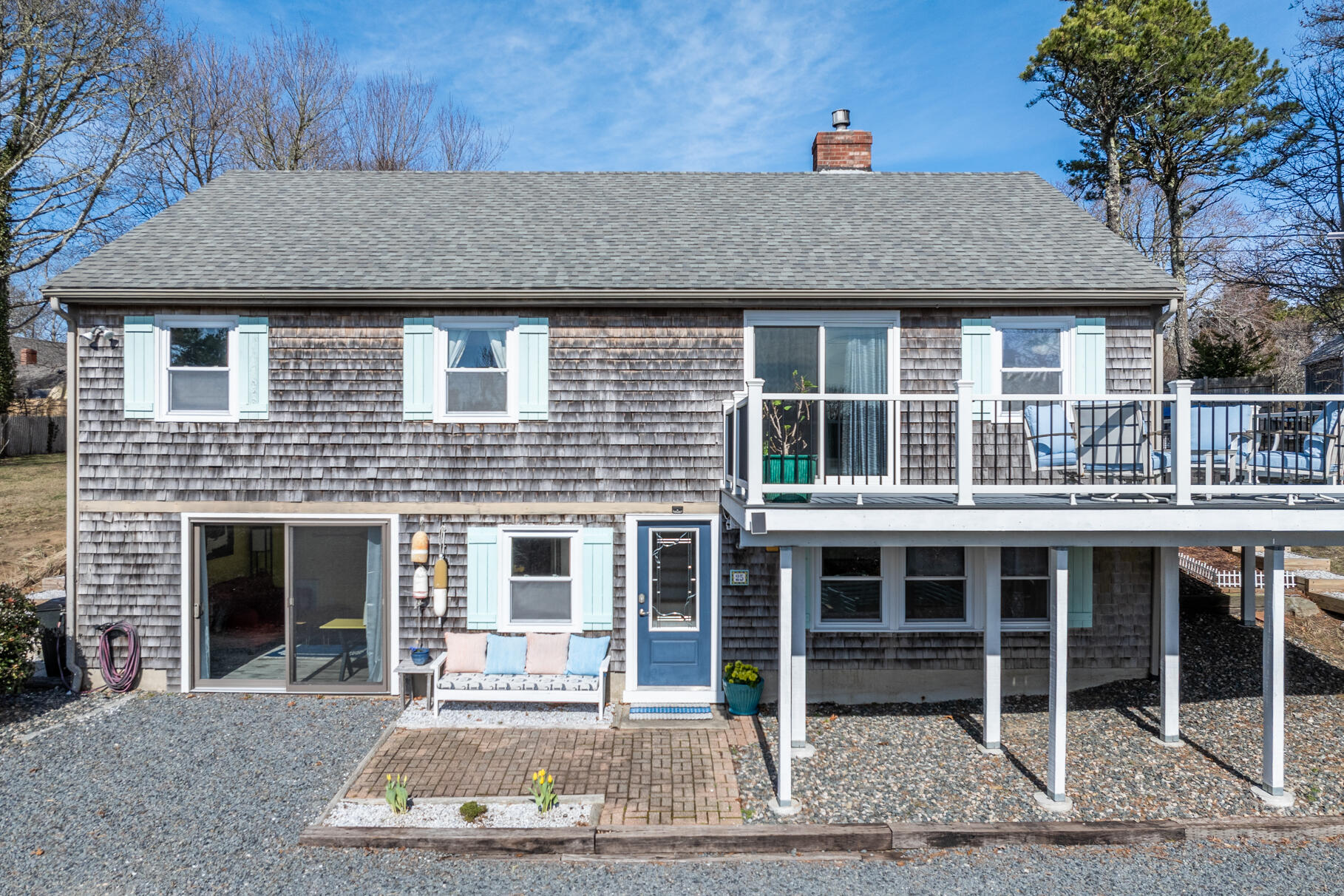 25 Cranberry Road Eastham, MA 02642 - Photo 6 of 45 a front view of a house with a yard