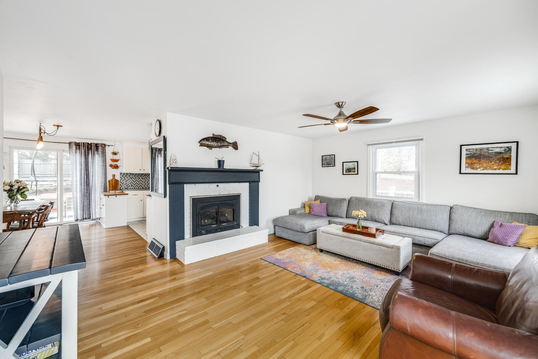 25 Cranberry Road Eastham, MA 02642 - Photo 8 of 45 a living room with furniture and a fireplace