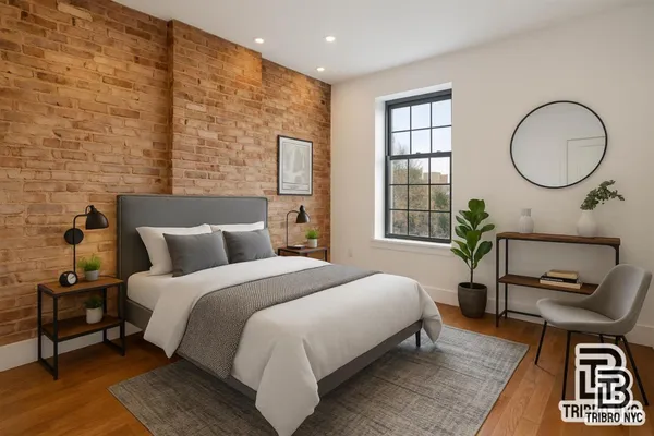 a bedroom with bed and a window