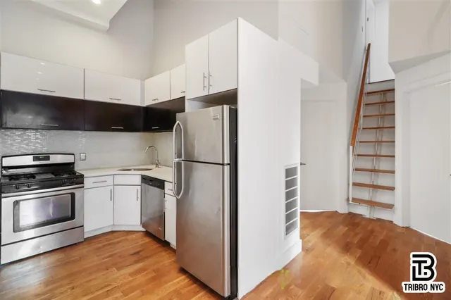 a kitchen with appliances and cabinets