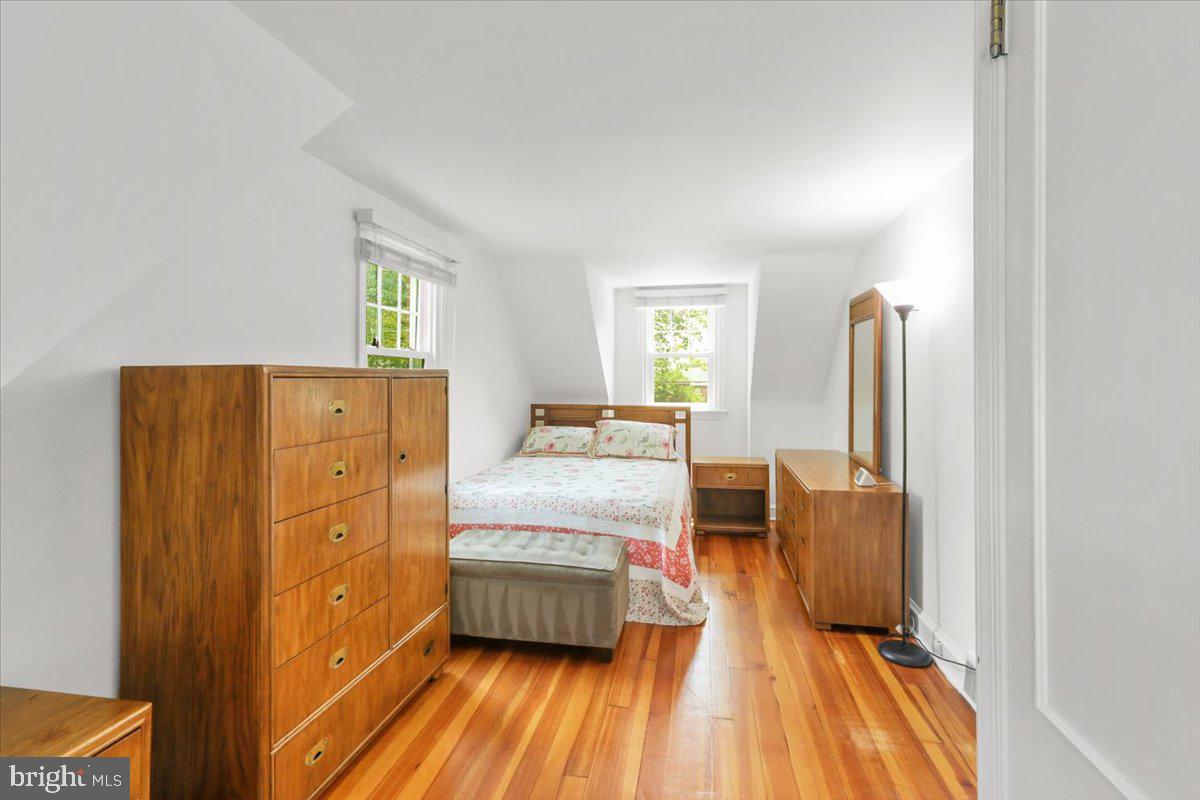 515 Arbor Road Cheltenham, PA 19012 - Photo 15 of 32 a bedroom with a bed and wooden floor