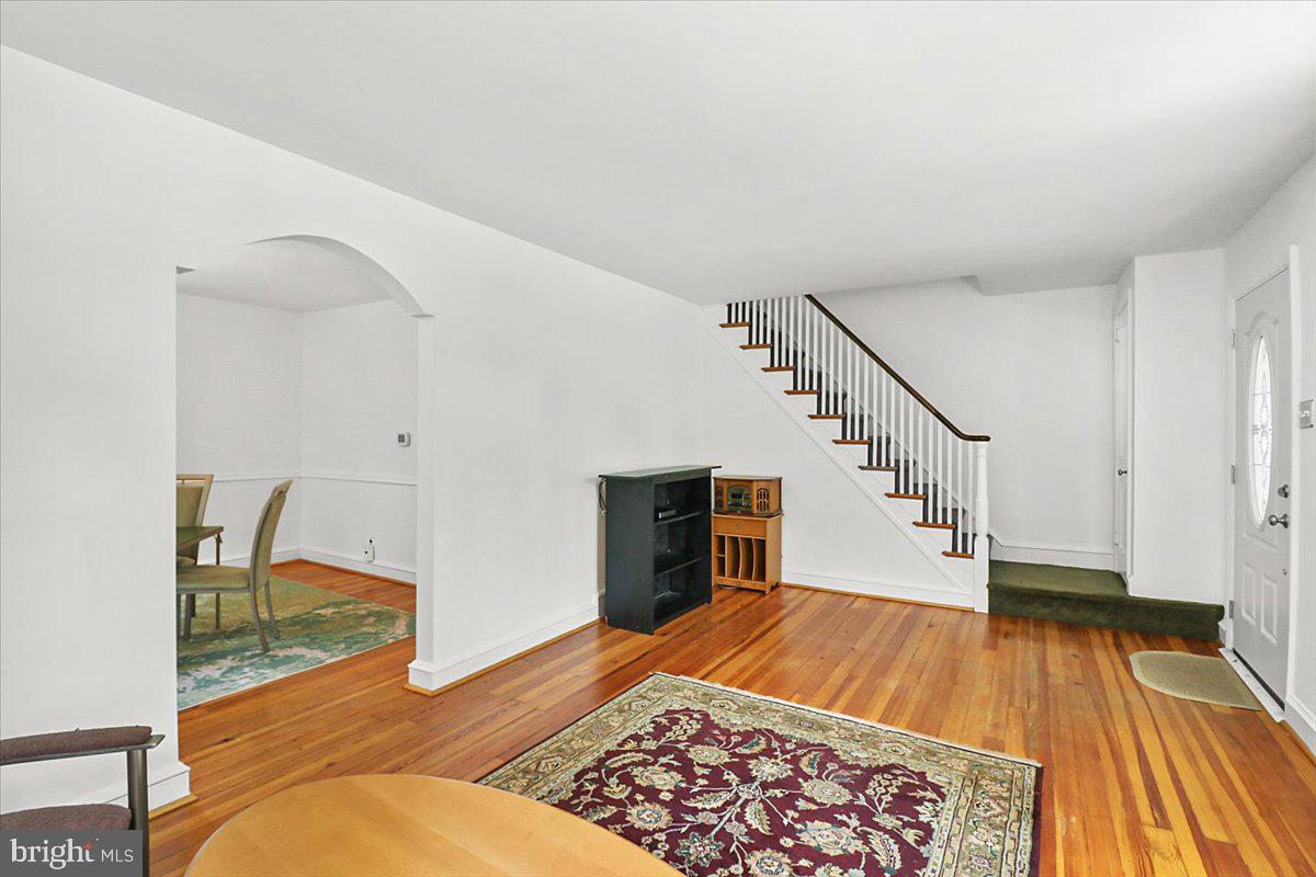 515 Arbor Road Cheltenham, PA 19012 - Photo 5 of 32 a view of an empty room with wooden floor and stairs