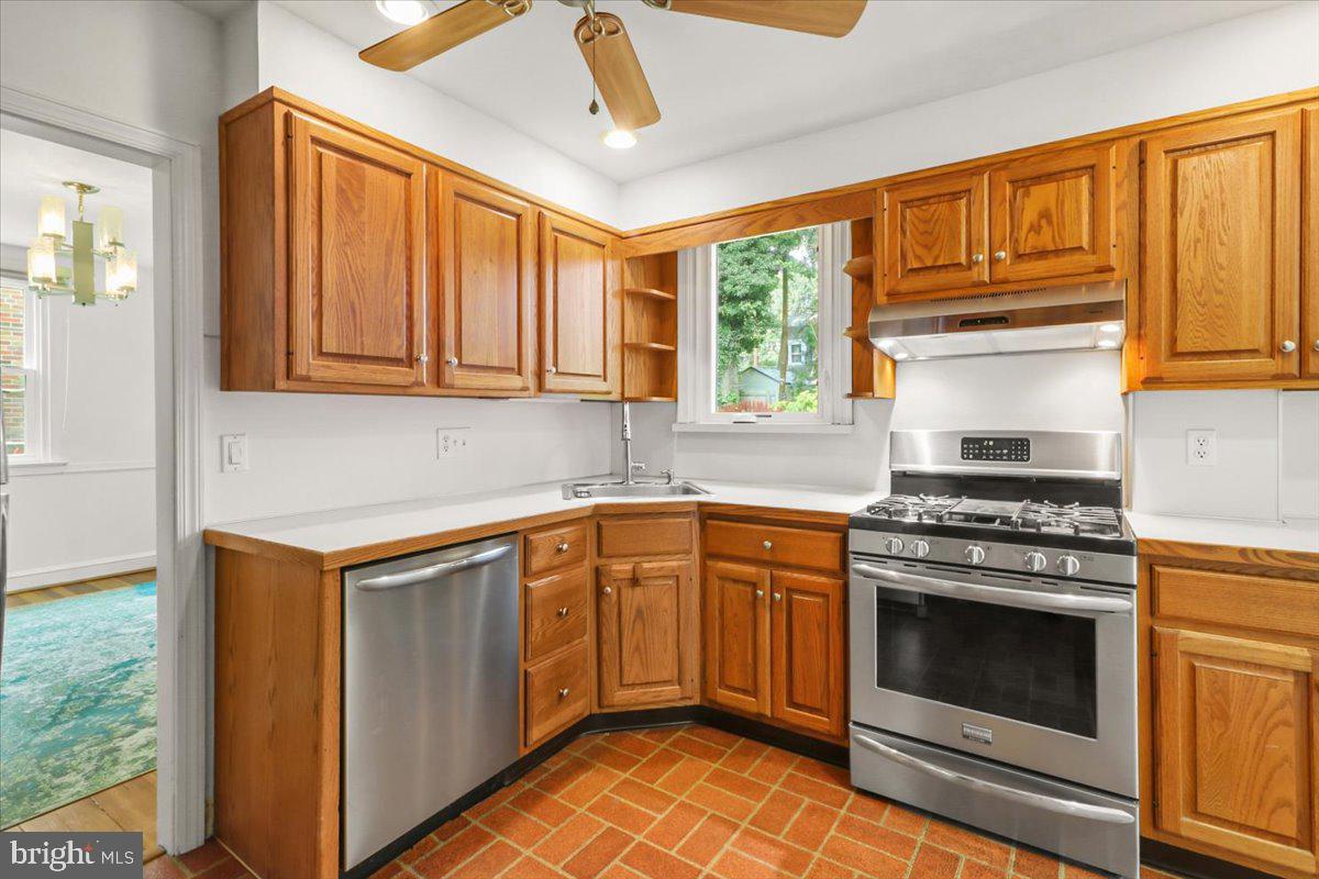 515 Arbor Road Cheltenham, PA 19012 - Photo 9 of 32 a kitchen with granite countertop cabinets stainless steel appliances and a window