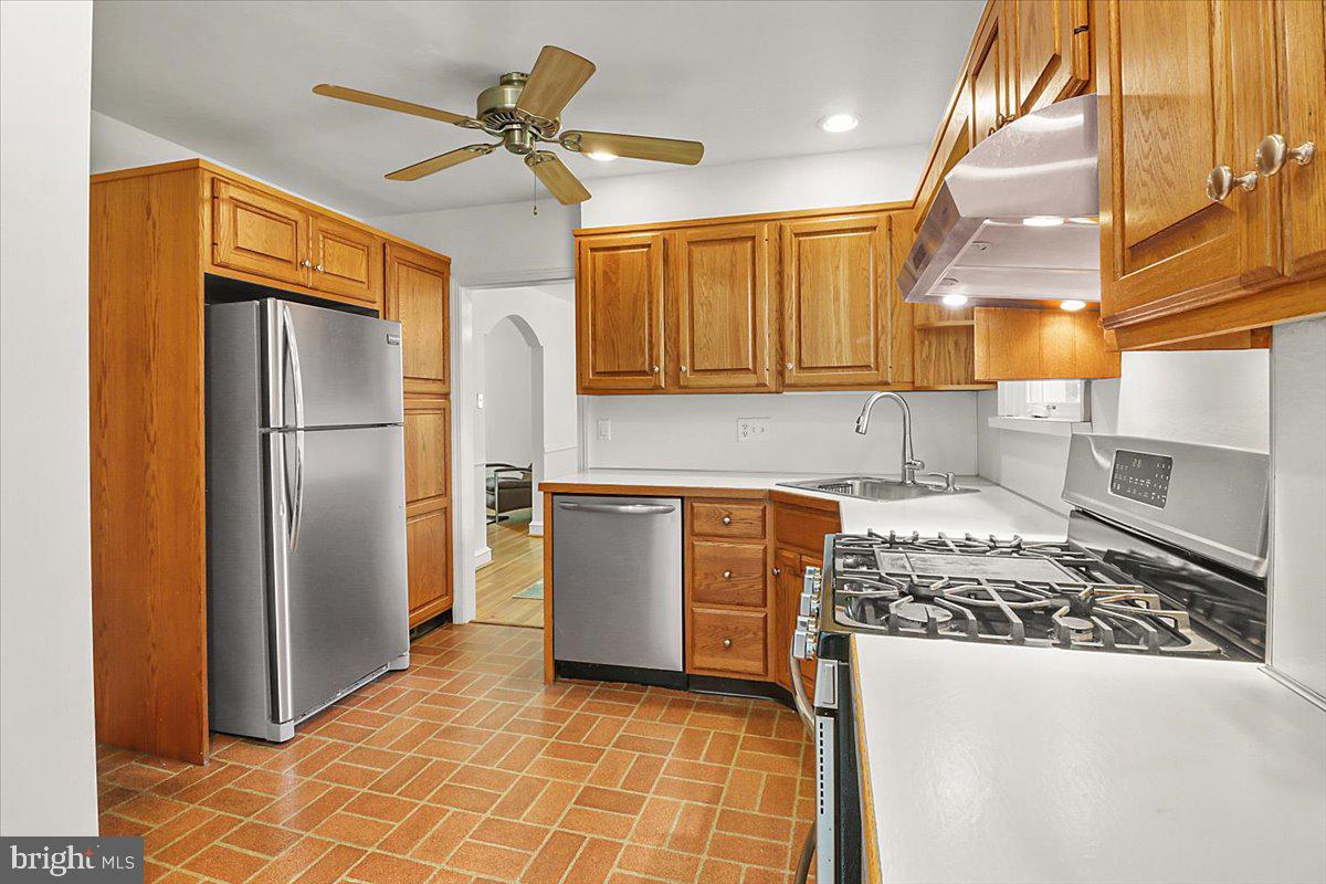 515 Arbor Road Cheltenham, PA 19012 - Photo 10 of 32 a kitchen with refrigerator cabinets and a counter top space