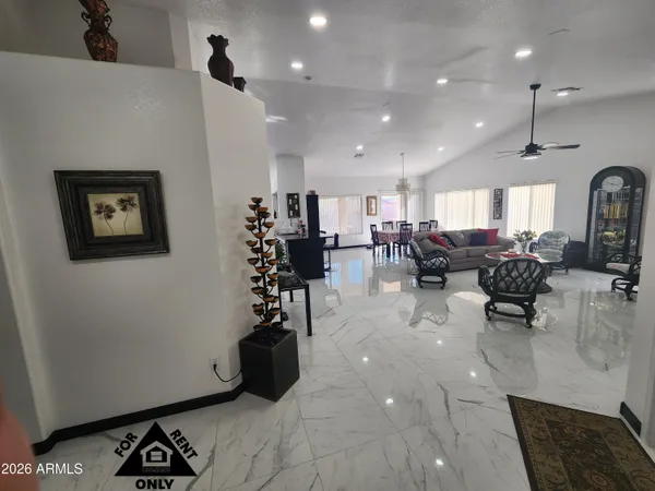 a living room with lots of furniture and gym equipment