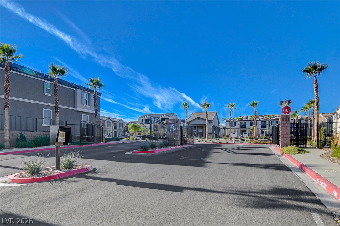 484 Filaree Place Henderson, NV 89015 - Photo 70 of 71 This community entrance welcomes residents with lush landscaping and easy access to residences.
