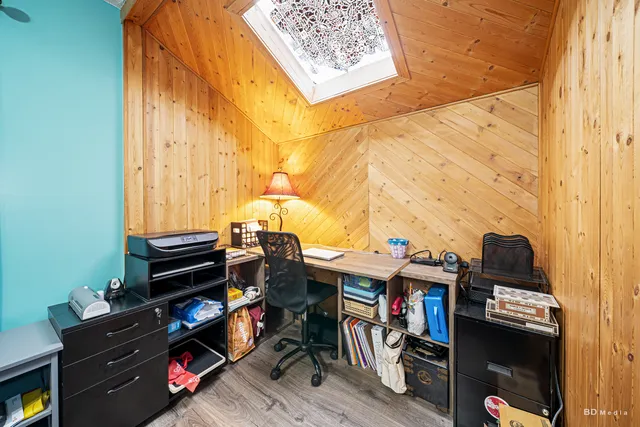 a view of workspace with wooden floor