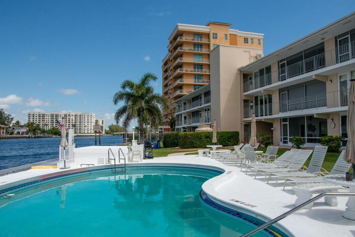 801 North Riverside Drive, Unit 5C Pompano Beach, FL 33062 - Photo 6 of 32 Waters edge heated swimming pool