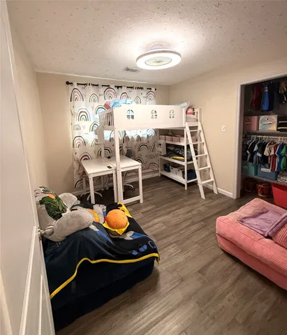 a room with furniture and wooden floor