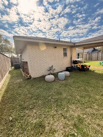 a kitchen with granite countertop a sink and a stove