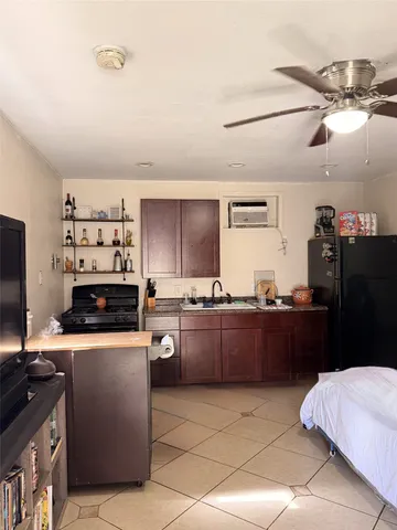 a bathroom with a shower curtain and a sink