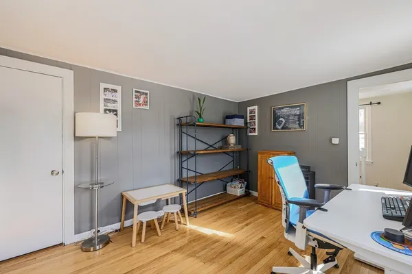 a room with furniture and a wooden floor