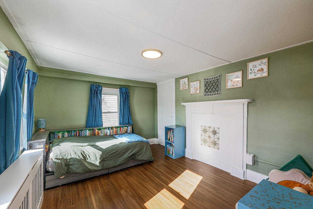 10 Metropolitan Avenue Ashland, MA 01721 - Photo 20 of 34 a bedroom with a bed and wooden floor