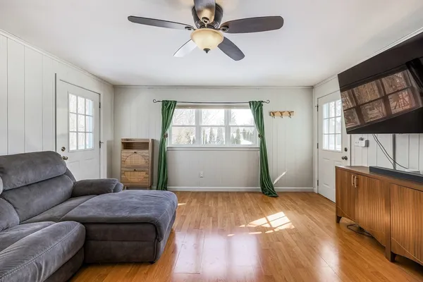 a living room with furniture and a window